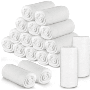 A stack of white paper towels next to rolls.